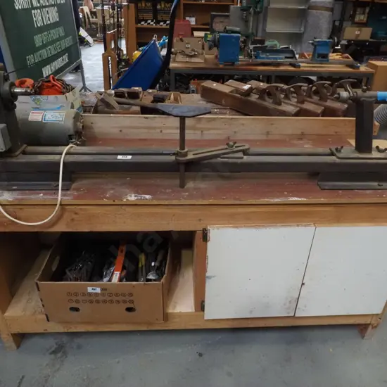 long woodworker's lathe on stand