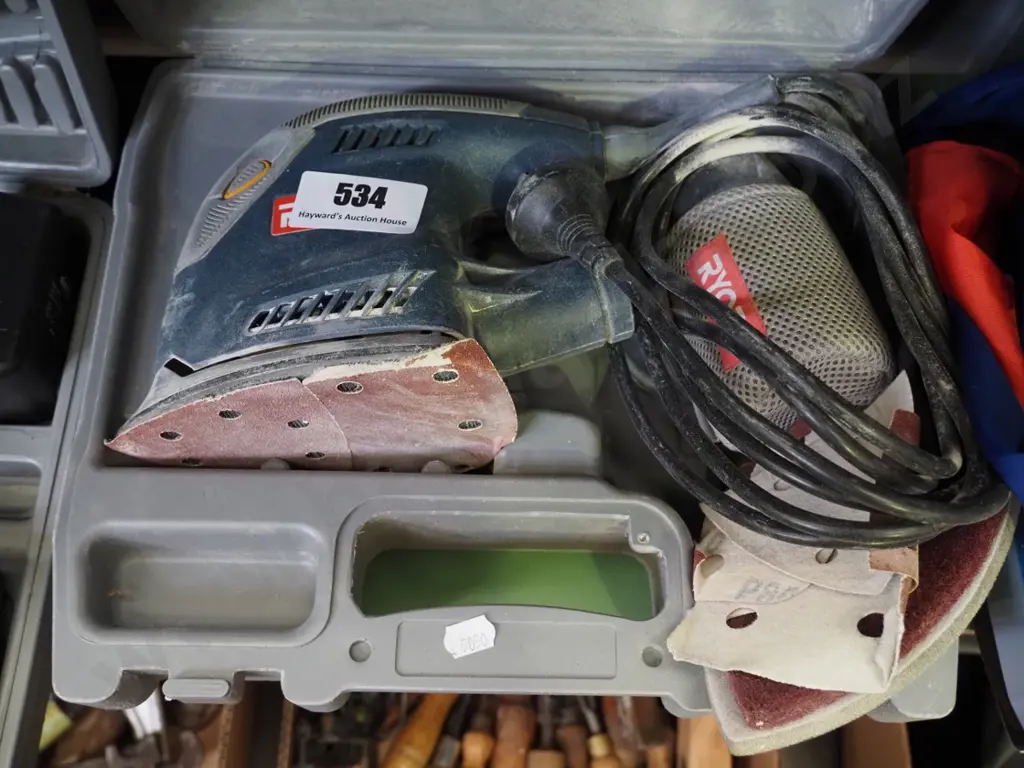 cased Ryobi orbital sander Image 1++