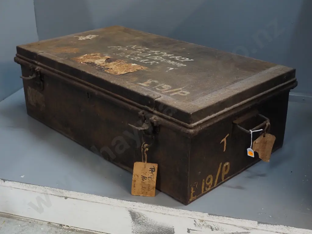 metal trunk / foot locker - marked RO Brown RNZAF - hanging tag marked Oamaru - some damage / corrosion H250 W800 D440 Image 1++