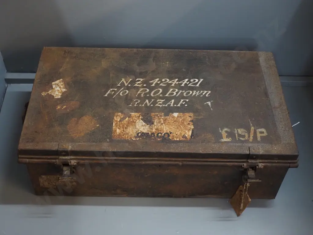 metal trunk / foot locker - marked RO Brown RNZAF - hanging tag marked Oamaru - some damage / corrosion H250 W800 D440 Image 1++