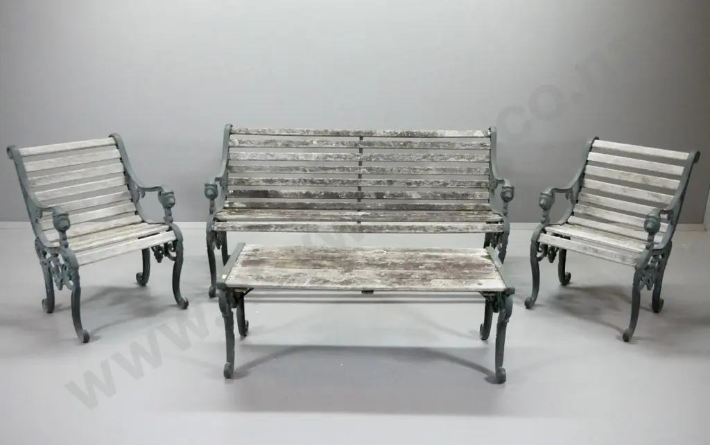 4-piece Victorian style outdoor setting with bench, 2 chairs & low table, cast iron lion head ends. Some wobbling - aged Image 1++