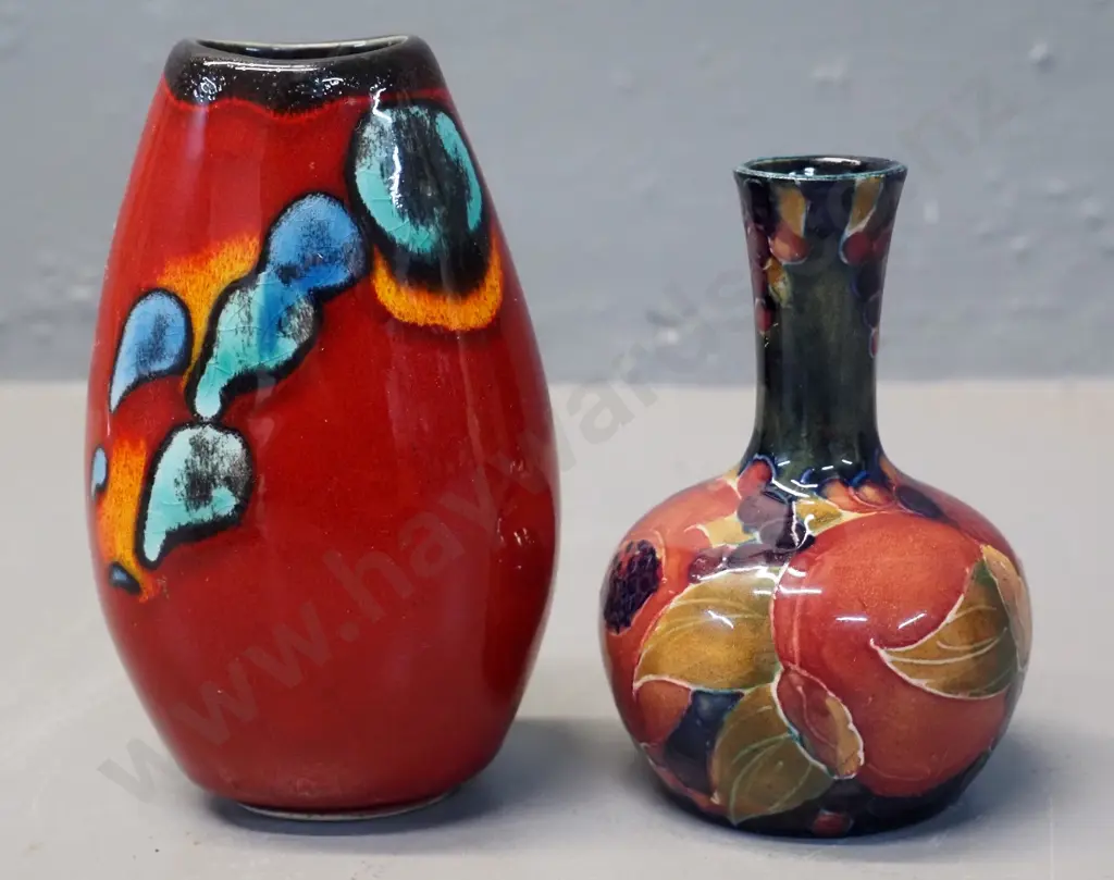 two small vases - signed Moorcroft pomegranate H-100 D-60 and a Poole H-110 Image 1++