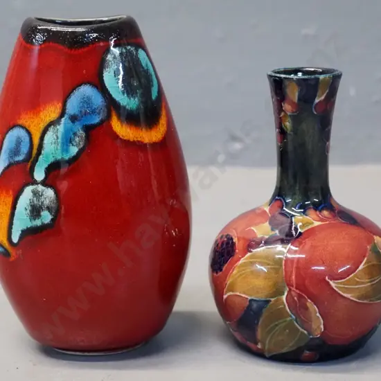two small vases - signed Moorcroft pomegranate H-100 D-60 and a Poole H-110