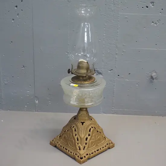 gold-finish metal based kerosene lamp with clear moulded glass tank, with chimney