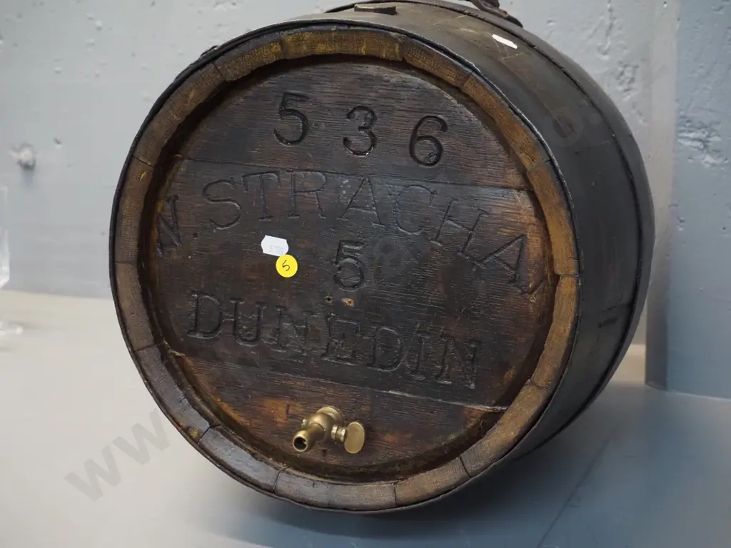 wooden barrel with engraved N. Strachan Dunedin brass tap, leather & wood flap on side - one loose strap H-440 D380- Image 1++
