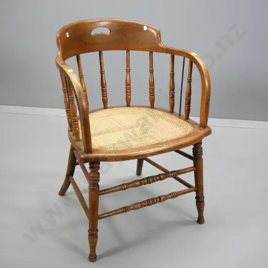vintage oak captain's chair with woven rattan seat, spindle back, small repair on front H-780 W-530 D-500