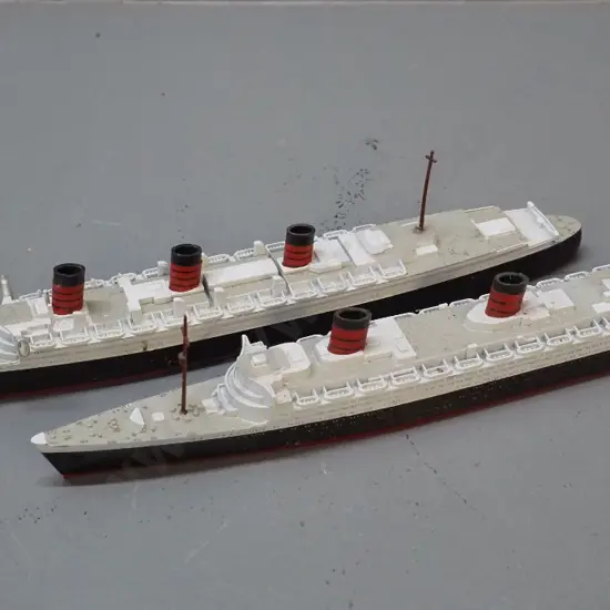 2 small ship models - Queen Elizabeth & Queen Mary, die cast metal and plastic, marked Made in Hong Kong, longer is L260