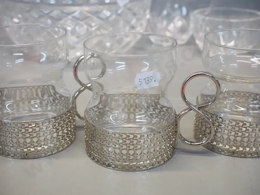 4 Iittala Finland tea cups with metal holders, 2 champagne flutes, and a cut crystal salad bowl, cream & sugar Image 1++
