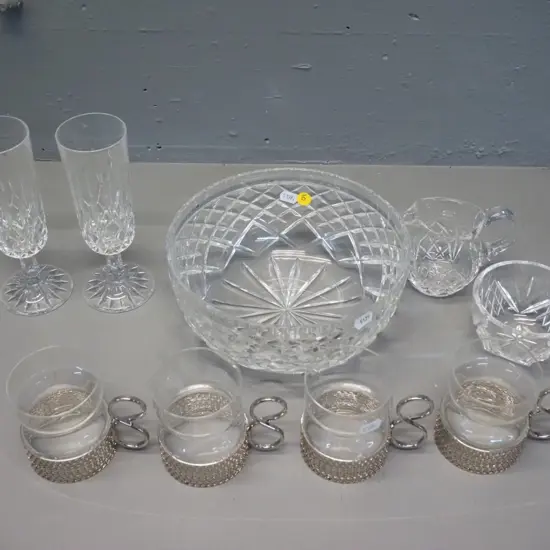 4 Iittala Finland tea cups with metal holders, 2 champagne flutes, and a cut crystal salad bowl, cream & sugar