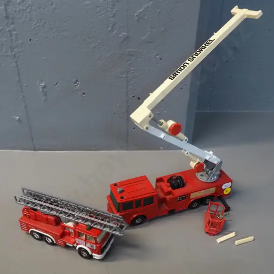 2 die-cast Matchbox Super King model firefighting vehicles - snorkel truck has damage, bucket holding parts snapped