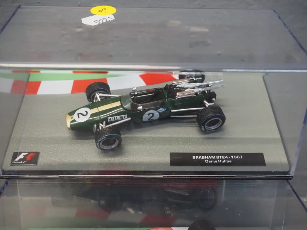 2 die-cast 1:43 scale Formula 1 racing cars - 1967 Dennis Hulme and 1968 Graham Hill Image 1++