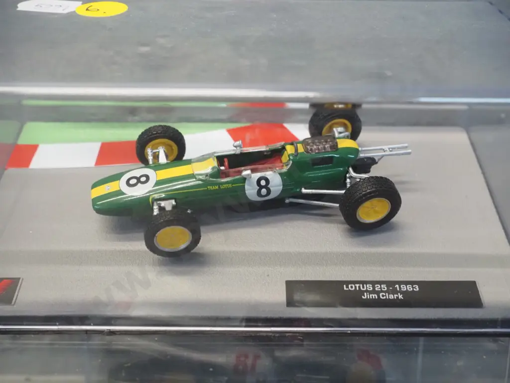 2 die-cast 1:43 scale Formula 1 racing cars - 1955 Juan Manuel Fangio and 1963 Jim Clarke Image 1++