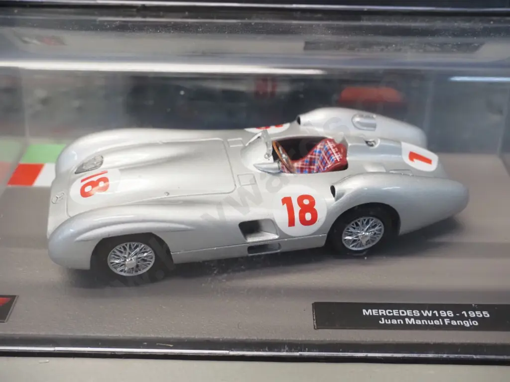 2 die-cast 1:43 scale Formula 1 racing cars - 1955 Juan Manuel Fangio and 1963 Jim Clarke Image 1++