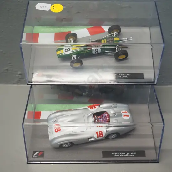 2 die-cast 1:43 scale Formula 1 racing cars - 1955 Juan Manuel Fangio and 1963 Jim Clarke