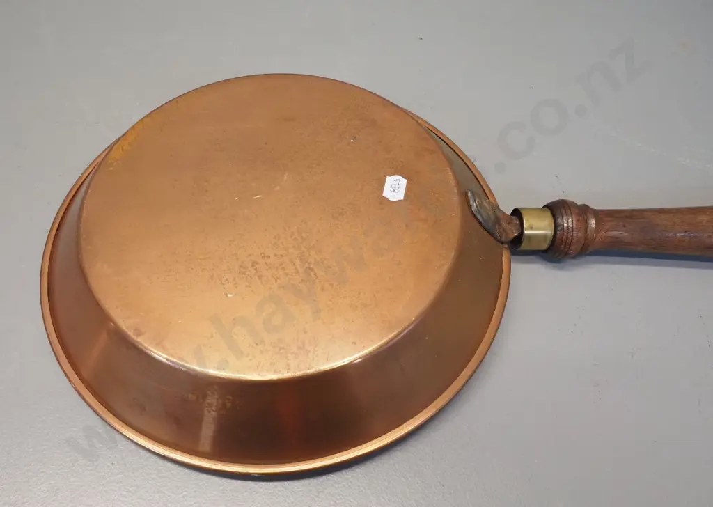 ornamental copper pan, wooden handle has brass collar, pan marked Soho Foundry Ballarat L-610 Pan D-270 Image 1++