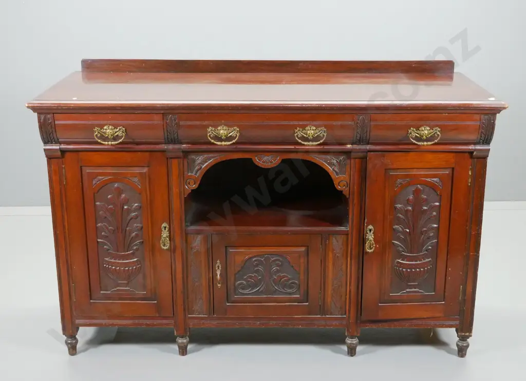 vintage dark stained kauri sideboard with 3 doors, 3 drawers, ornate brass drop handles, carved detail, some marks to Image 1++