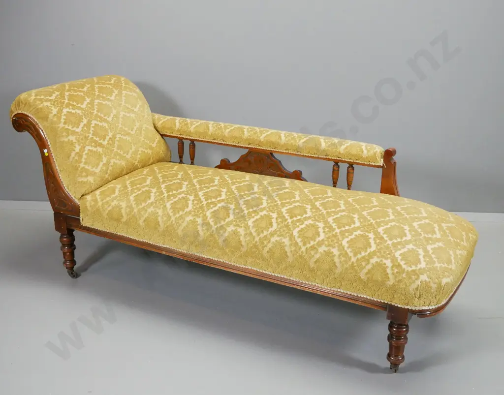 Edwardian chaise longue w/ nouveau style carved detail, on casters, turned spindles and legs, covered in Image 1++