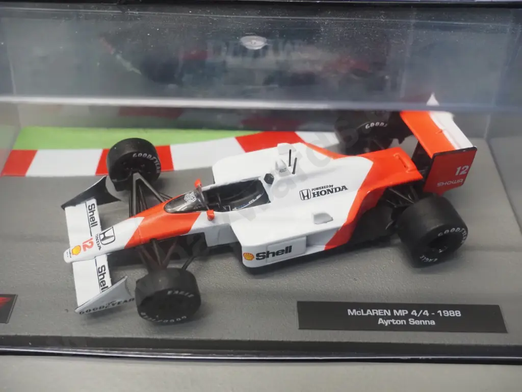 2 die-cast 1:43 scale Formula 1 racing cars - 1982 Michele Alboretto and 1988 Ayrton Senna Image 1++