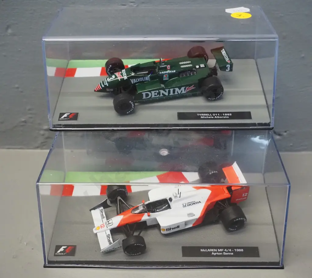 2 die-cast 1:43 scale Formula 1 racing cars - 1982 Michele Alboretto and 1988 Ayrton Senna Image 1++