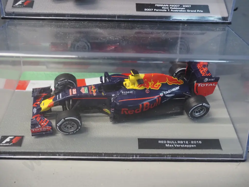 2 die-cast 1:43 scale Formula 1 racing cars - 2007 Kimi Raikkonen and 2016 Max Verstappen Image 1++