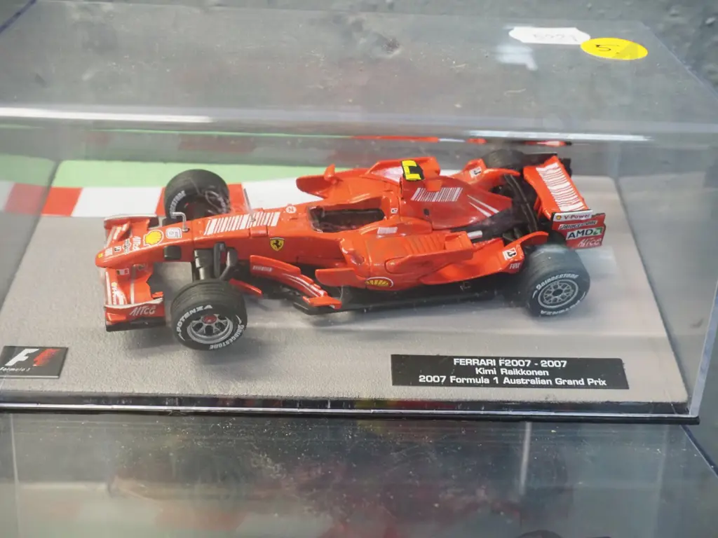 2 die-cast 1:43 scale Formula 1 racing cars - 2007 Kimi Raikkonen and 2016 Max Verstappen Image 1++