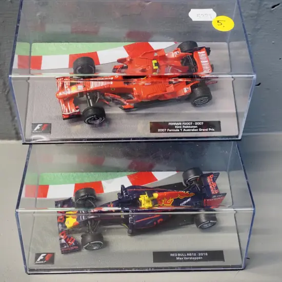 2 die-cast 1:43 scale Formula 1 racing cars - 2007 Kimi Raikkonen and 2016 Max Verstappen