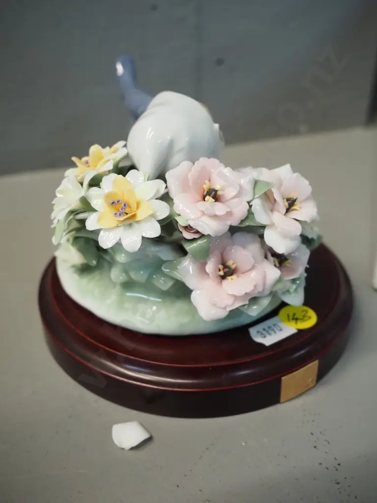 Lladro figure of pixie reclining in flowers, 1 leaf chipped off. H100 L130, comes with composite base & original box Image 1++