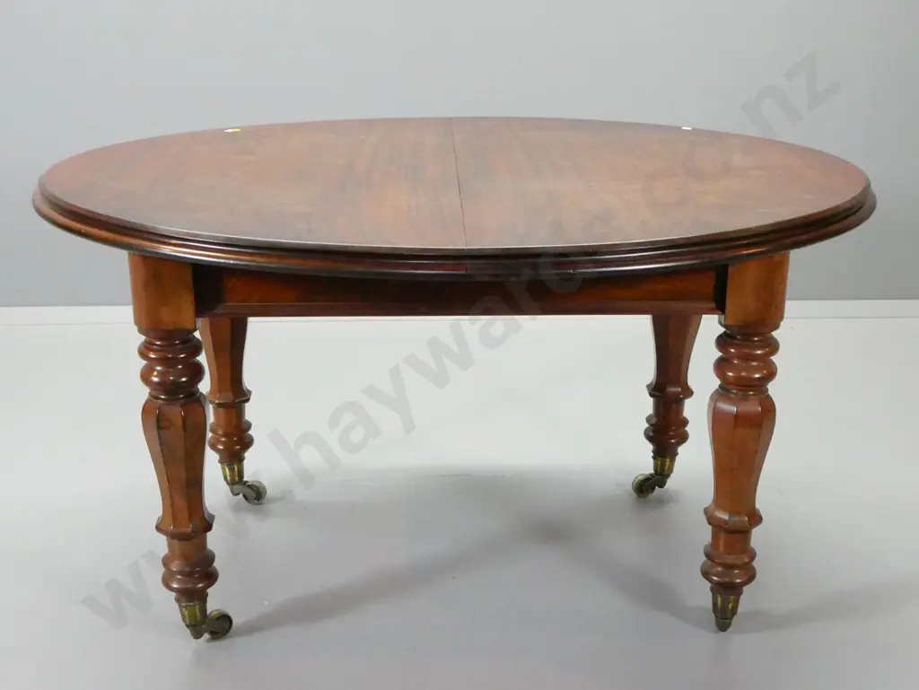 vintage mahogany oval extending dining table w/brass casters, 2 leaves, w/ 6 reproduction solid timber chairs Image 1++
