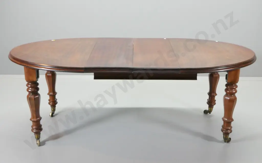 vintage mahogany oval extending dining table w/brass casters, 2 leaves, w/ 6 reproduction solid timber chairs Image 1++