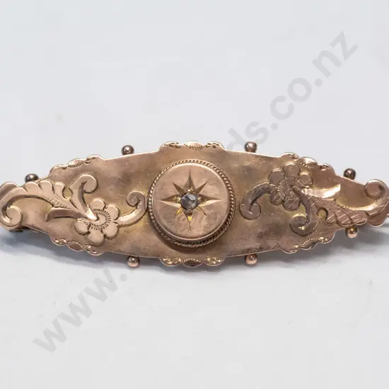 gold brooch in original box