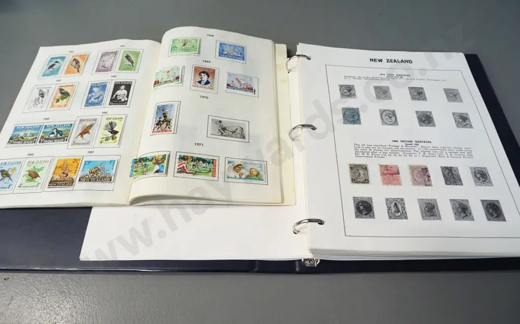 2 New Zealand stamp albums - earliest are 1873 newspaper stamp, 1880s postal stamps, health stamps etc. Image 1++