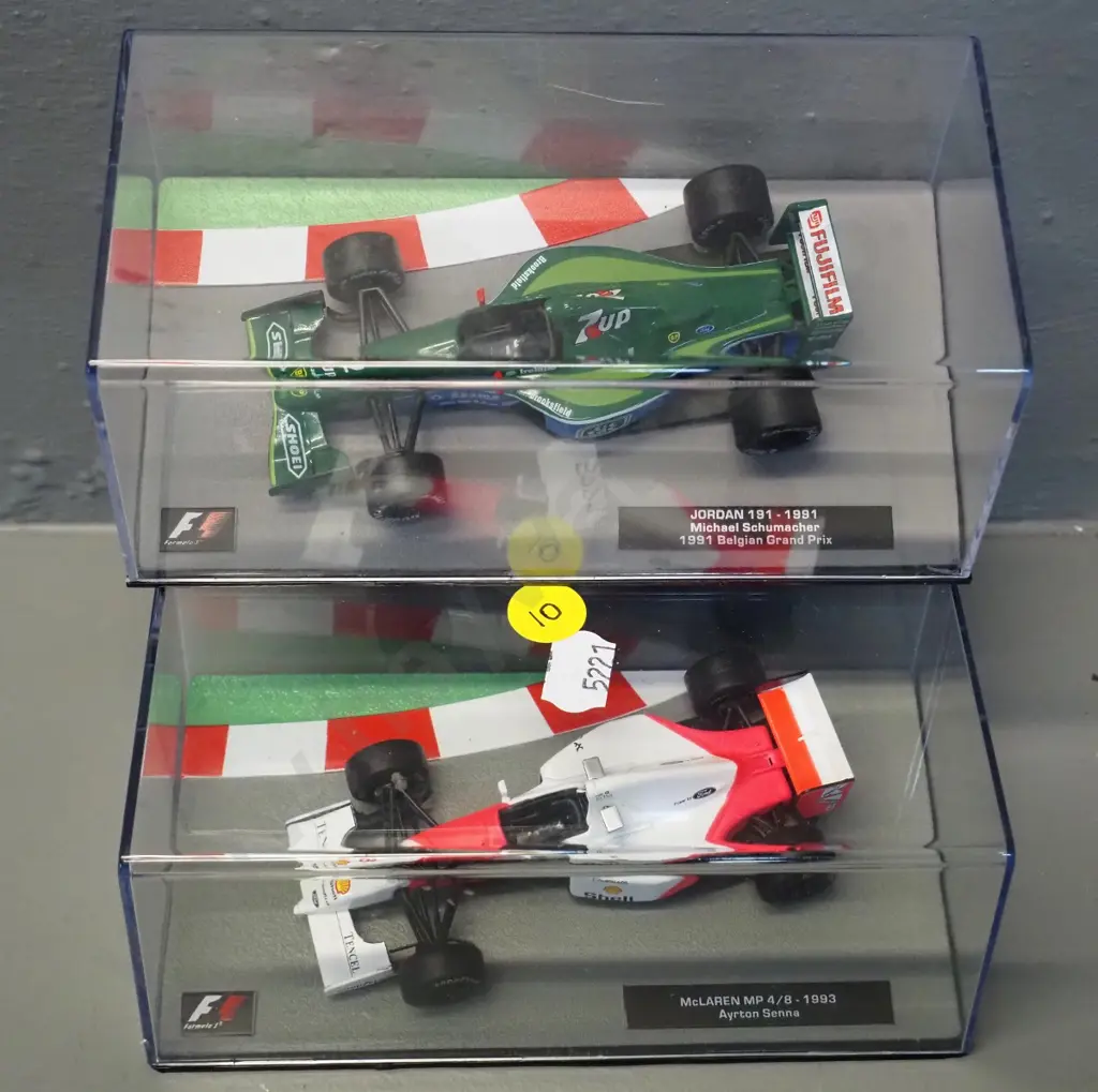 2 die-cast 1:43 scale Formula 1 racing cars - 1991 Michael Schumacher and Ayrton Senna Image 1++