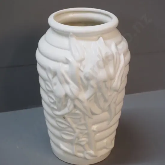white vase with ribbed and raised flower design - hard to read mark on base H-270