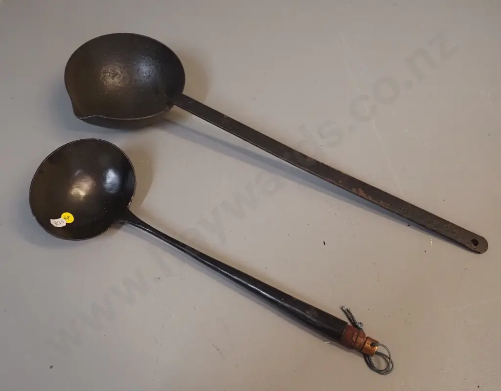 2 vintage cast iron ladles - longer is L-530 with pouring lip, other has wooden tip on handle Image 1++