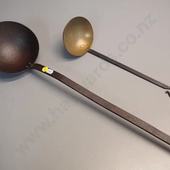 2 vintage ladles - one cast iron L-510, other is brass with cast iron handle