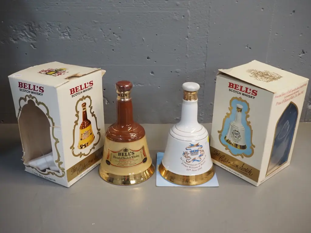 2 sealed 500ml Bell whisky decanters w/boxes: commemorative 1982 Prince William, box of other one in rough shape Image 1++