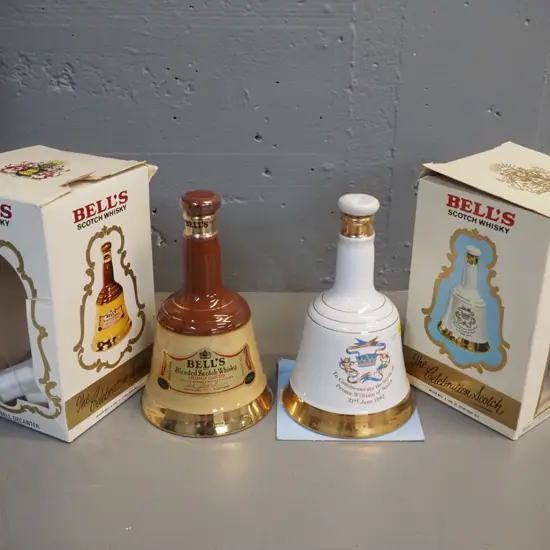 2 sealed 500ml Bell whisky decanters w/boxes: commemorative 1982 Prince William, box of other one in rough shape