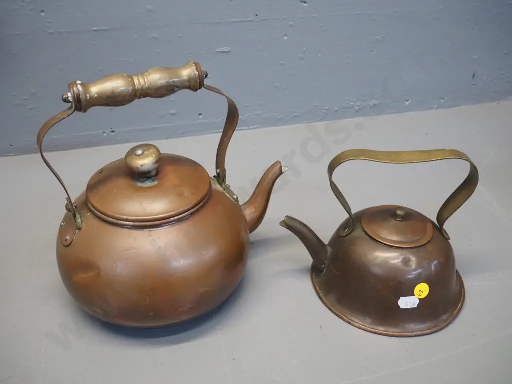 2 vintage small copper kettles, one w/brass handle, one w/wooden handle H220 W-230, both have minor denting Image 1++
