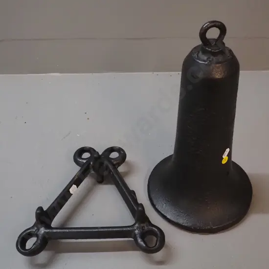 heavy gauge cast iron bell-shaped object with hanging loop and hole drilled H350 and a triangular frame with eyelets