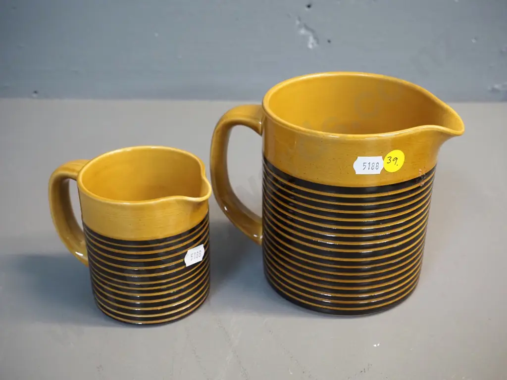 2 T&G Greene fine stripe gold and black jugs, larger is H-130 W-160 Image 1++