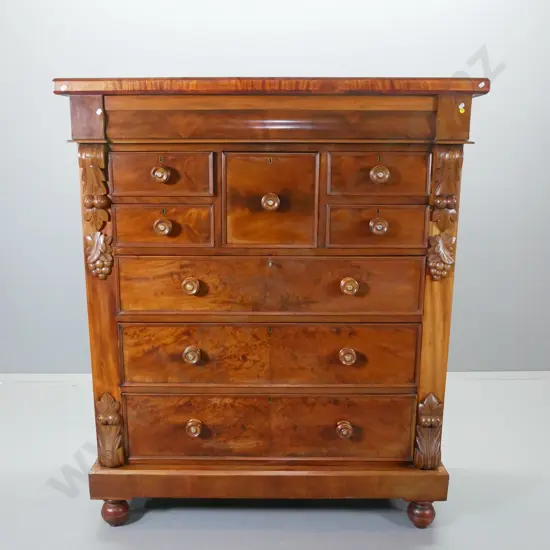 antique walnut full-size 9-drawer Scotch chest, flame veneer fronts, carved corbels, mother of pearl inserts on knobs