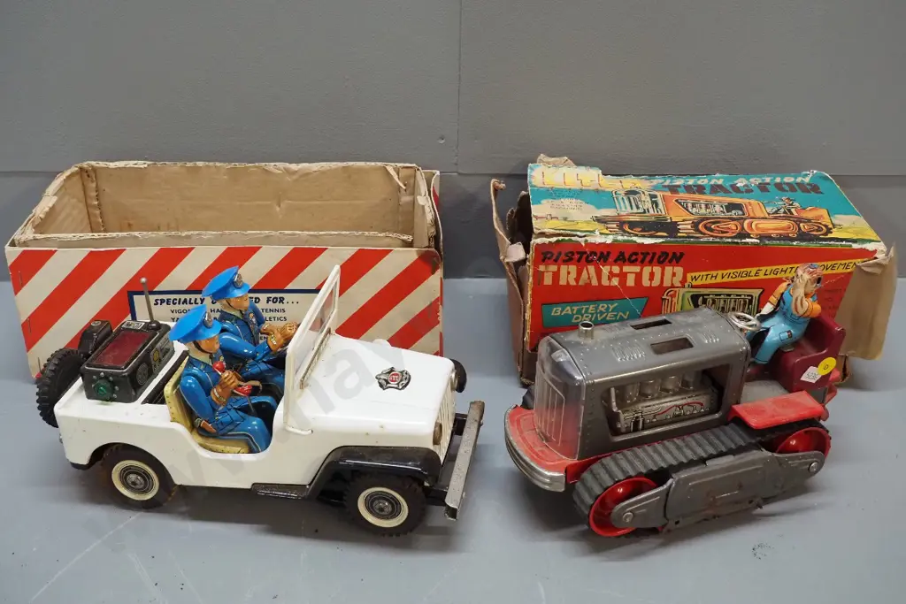 2 vintage Japanese tin toy vehicles - police jeep and tractor with separate driver, box - both with corrosion and damage Image 1++
