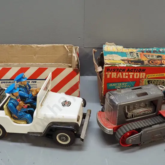 2 vintage Japanese tin toy vehicles - police jeep and tractor with separate driver, box - both with corrosion and damage