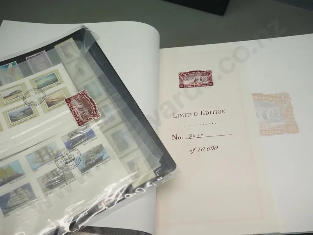 3 slip-cased NZ stamp collector's  sets - Millennium, Pictorial Centenary, & New Zealand Heritage Image 1++