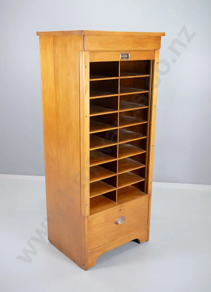 rimu cabinet ex Dunedin Post Office, vertical tambour door, pigeonholes, lower drawer, splits on ends Image 1++