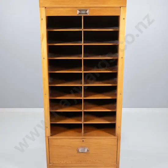 rimu cabinet ex Dunedin Post Office, vertical tambour door, pigeonholes, lower drawer, splits on ends