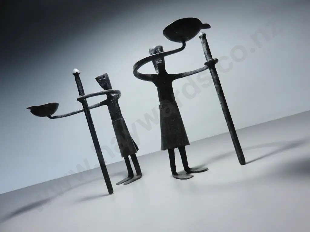 Pair of vintage brutalist metal figural candle holders Image 1++