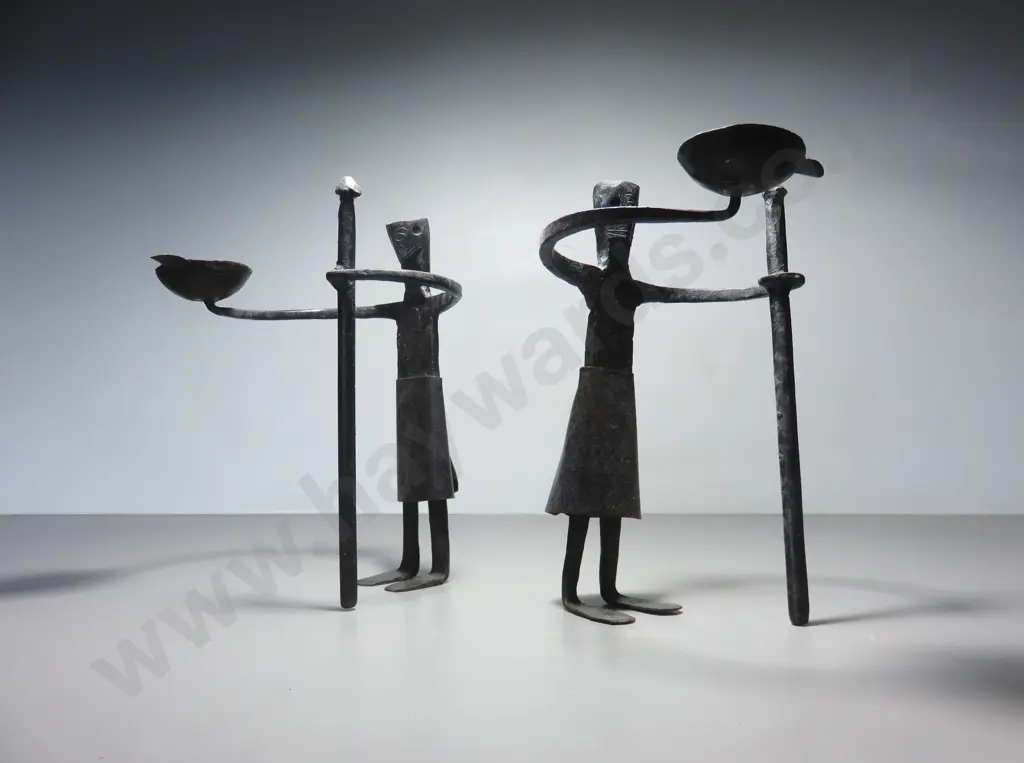 Pair of vintage brutalist metal figural candle holders Image 1++