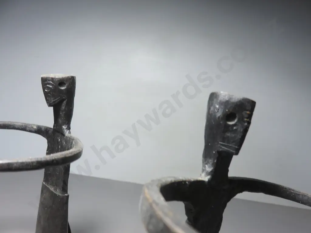 Pair of vintage brutalist metal figural candle holders Image 1++