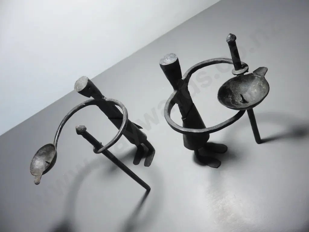 Pair of vintage brutalist metal figural candle holders Image 1++